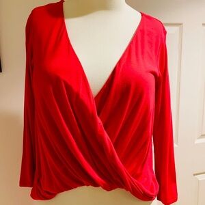 T56- Bebe high Low fuchsia top size S